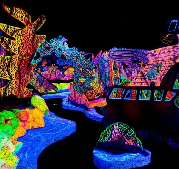Colourful blacklight mini golf course interior at Putting Edge in Halifax.