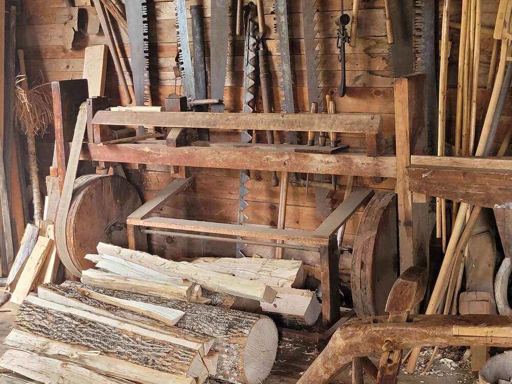 Traditional woodworking tools and wood splitting area at Ross Farm Museum New Ross Nova Scotia living history farm